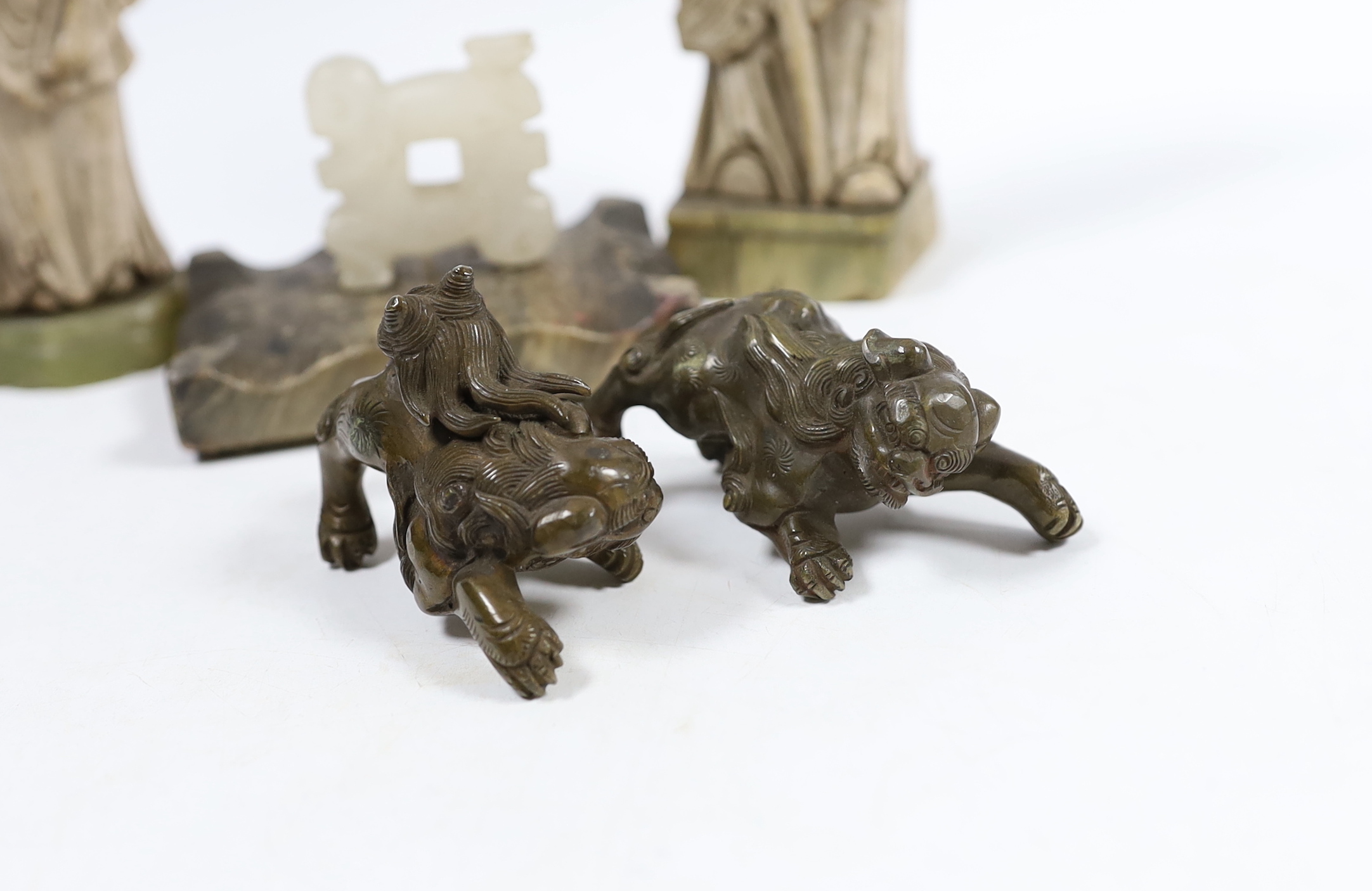 Two Chinese soapstone figures, two bronze lion dogs, etc. tallest figure 18cm high (4)